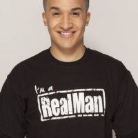 Jahmene Douglas wearing an I'm a Real Man T-shirt